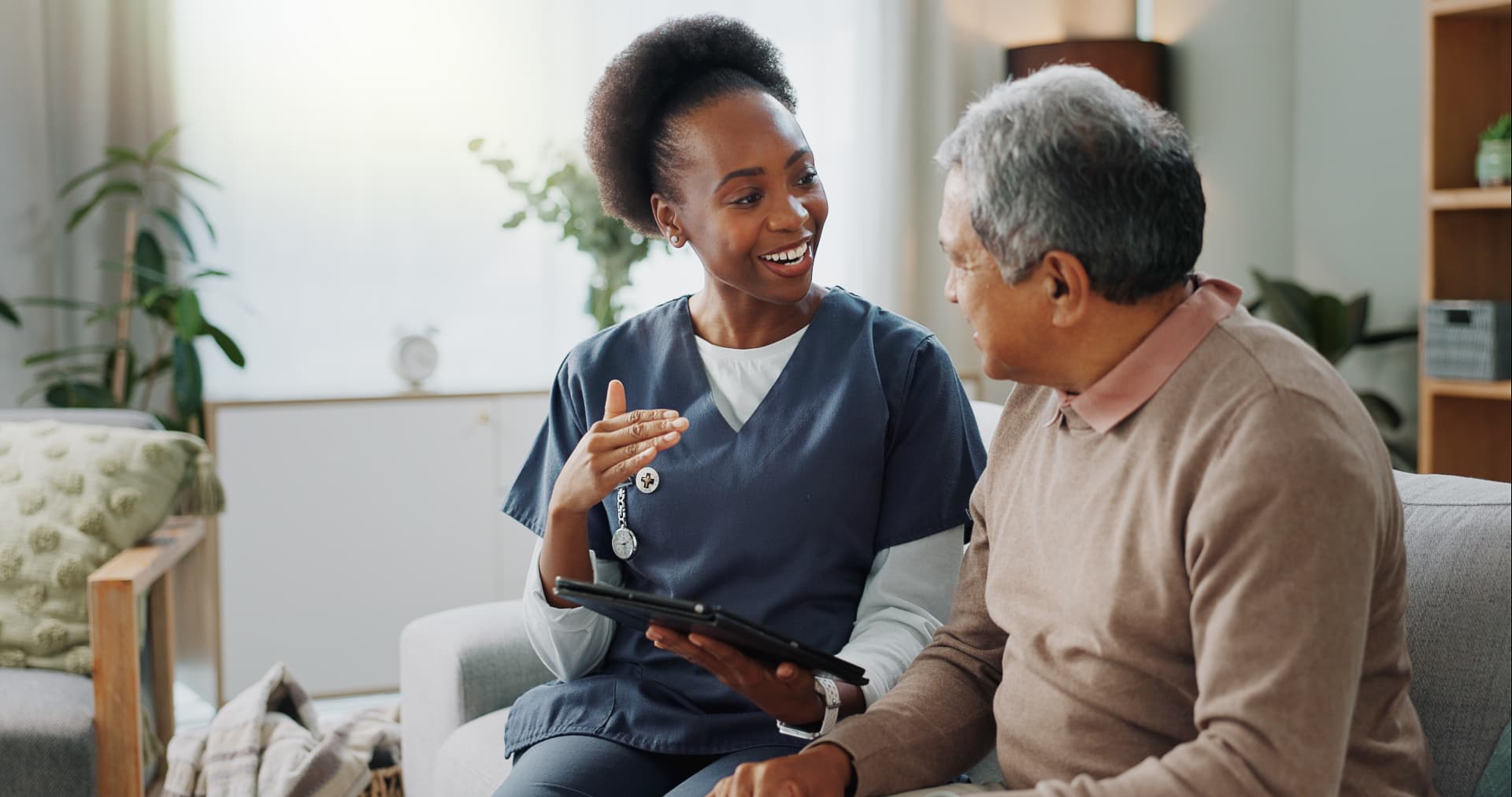 A nurse caring for a patient at home